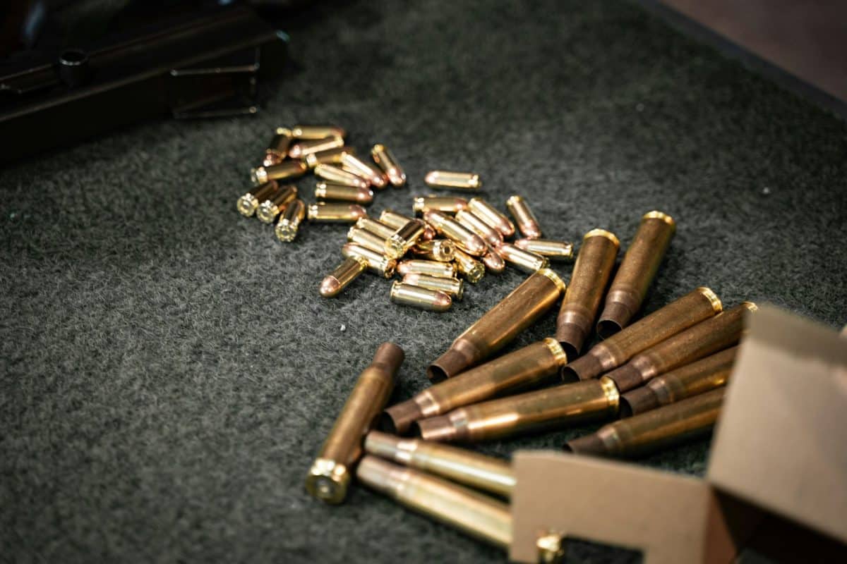 a bunch of bullet casings laying on the ground