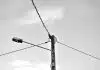 grayscale photo of electric post