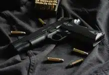 black semi automatic pistol on black textile