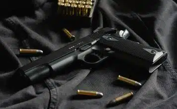 black semi automatic pistol on black textile